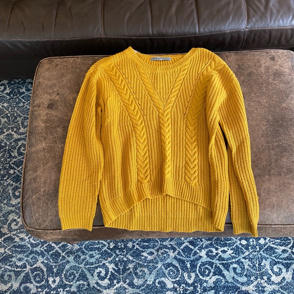 Mustard colored knit sweater, size medium, good condition.
